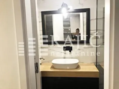 Modern bathroom with a sink and a mirror. - image 15