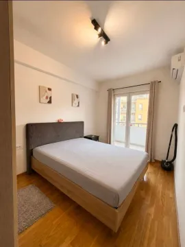 Furnished bedroom with a double bed and access to the terrace. - image 5