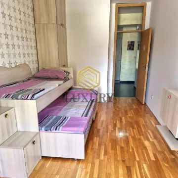 Children's bedroom with a bunk bed and wooden flooring. - image 10