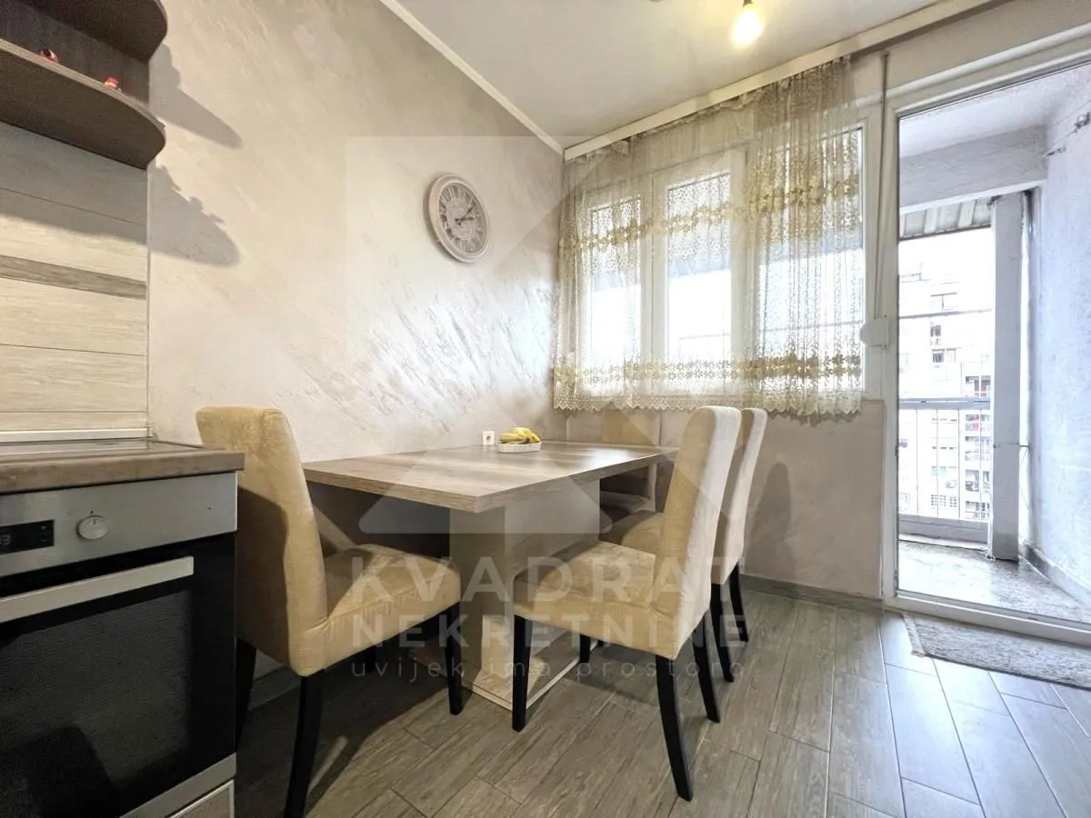 Dining area with a table and chairs as part of the kitchen.