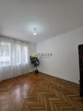 Empty room with parquet flooring and white walls. - image 2