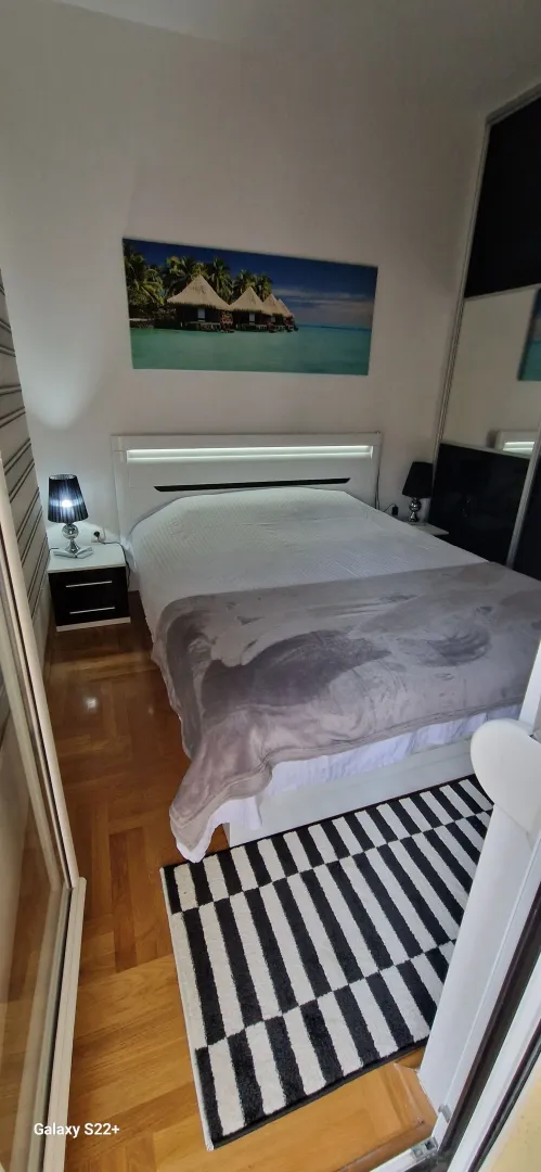 Furnished bedroom with a double bed.