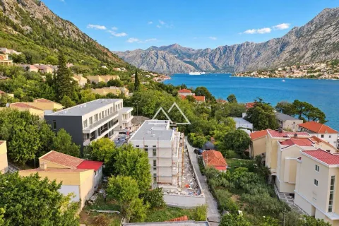 Bird's eye view of the bay, mountains, and buildings under construction. - image 9
