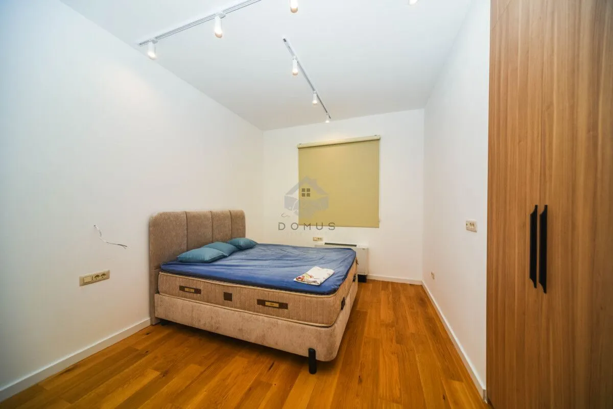 Bedroom with a double bed and a built-in wardrobe.