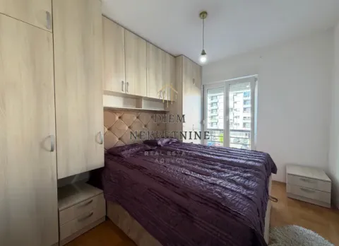 Furnished bedroom with a double bed, fitted wardrobes, and access to the terrace. - image 9