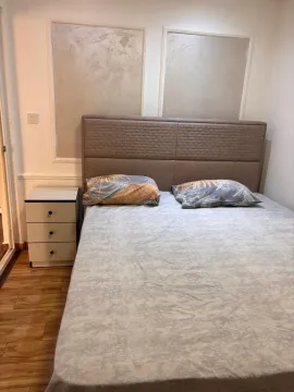 Bedroom with a double bed and a nightstand. - image 11