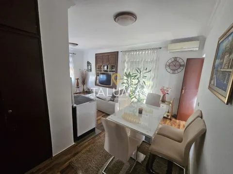 Living room with dining area and furniture. - image 3