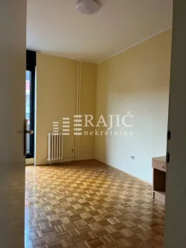 Empty room with parquet flooring and yellow walls. - image 17
