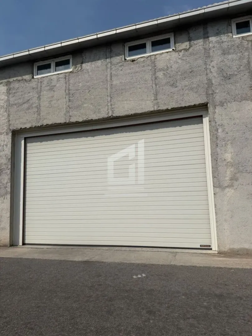 View of the garage door and the building facade.