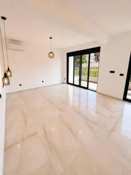 Empty living room with glossy tiles and access to the terrace. - image 8
