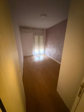 Empty room with wooden flooring and a window. - image 4
