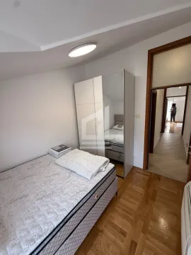 Small bedroom with a bed and wardrobe. - image 8