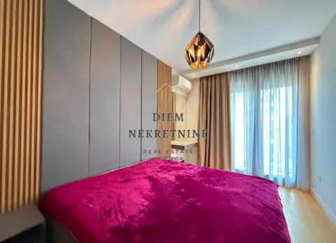 Modern bedroom with a double bed and decorative wall panels. - image 12