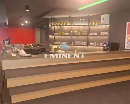 Interior of a commercial space with a bar counter and shelves for drinks. - image 8