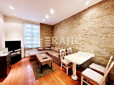 Living room with sofa and dining table. - image 12