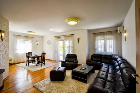 Spacious living room with seating furniture, a dining area, and hardwood flooring. - image 5