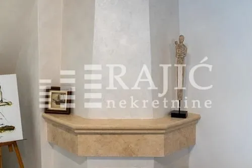 Interior detail featuring an ornamental fireplace and decorative elements.