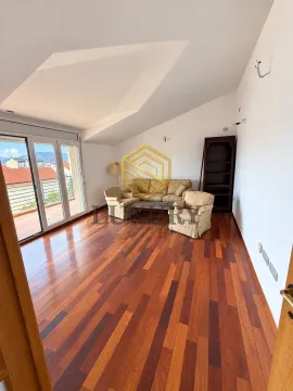Spacious living room with wooden flooring and seating set. - image 3