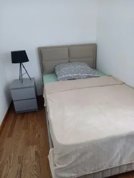 Small bedroom with a double bed and a nightstand. - image 7