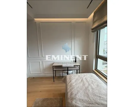 Small bedroom with a bed and a desk by the window. - image 10