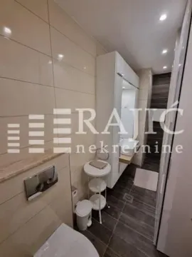 Modern bathroom with sanitary ware and built-in units. - image 8