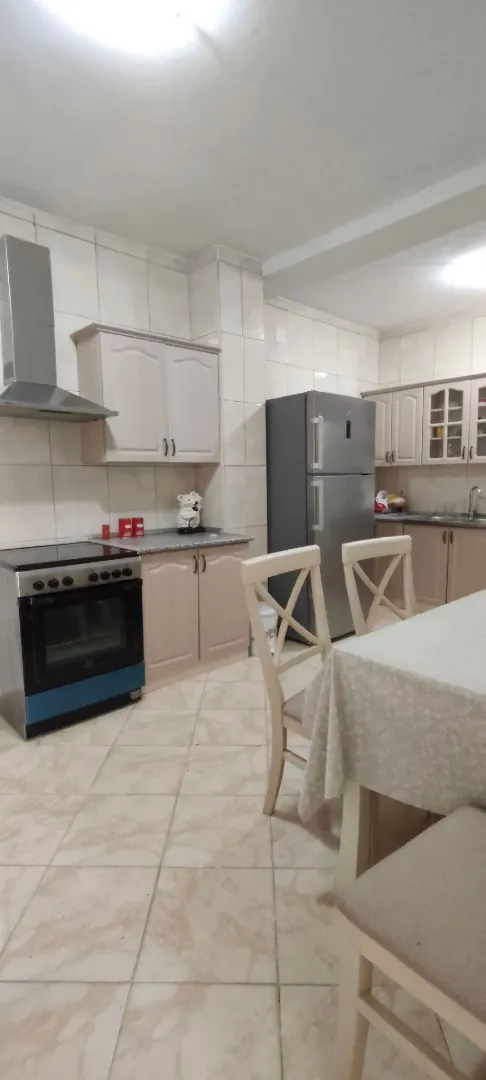 Spacious kitchen with a dining area and fitted units.