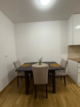Dining table with chairs within the kitchen area. - image 3