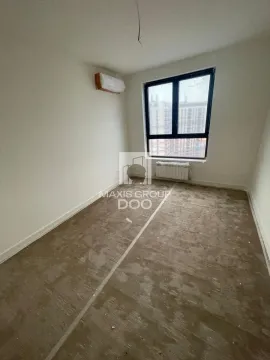 Empty unfinished room with a single window and an air conditioning unit on the wall. - image 4