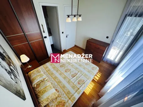 Furnished bedroom with a double bed, wardrobe, and chest of drawers. - image 8