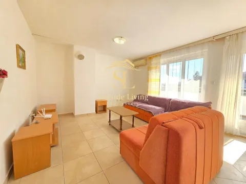 Living room with furniture and terrace access. - image 5