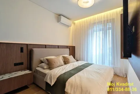 Modern bedroom with a double bed and recessed lighting. - image 5