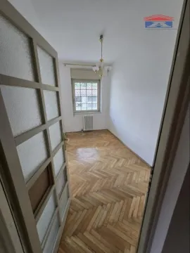 Empty room with hardwood parquet flooring and a window viewed from the doorway. - image 13