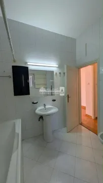 Bathroom with sink, mirror, and tiling. - image 18
