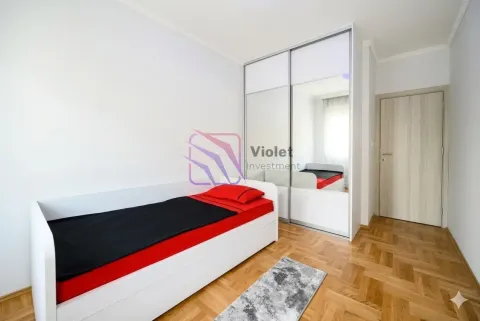 Small bedroom with a bed, a large mirrored wardrobe, and parquet flooring. - image 14