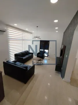 Living room with a sofa set and a TV unit. - image 8