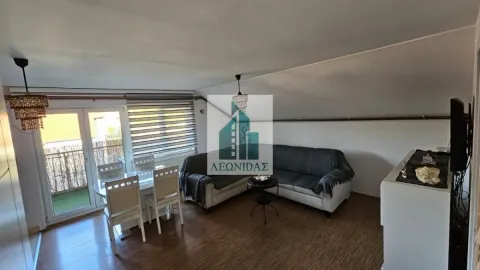 Living room with a sofa set and dining table, with access to the terrace. - image 2