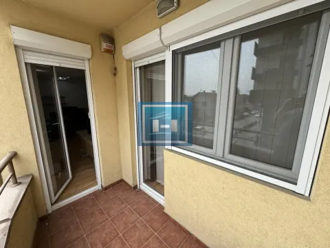 Covered balcony with tiled flooring and access to the apartment interior. - image 24