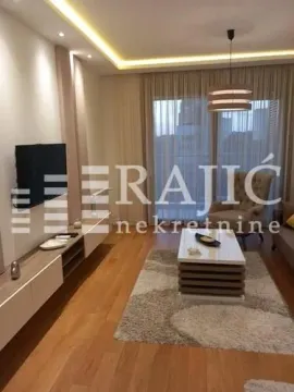 Modern and bright living room with furniture and TV. - image 2