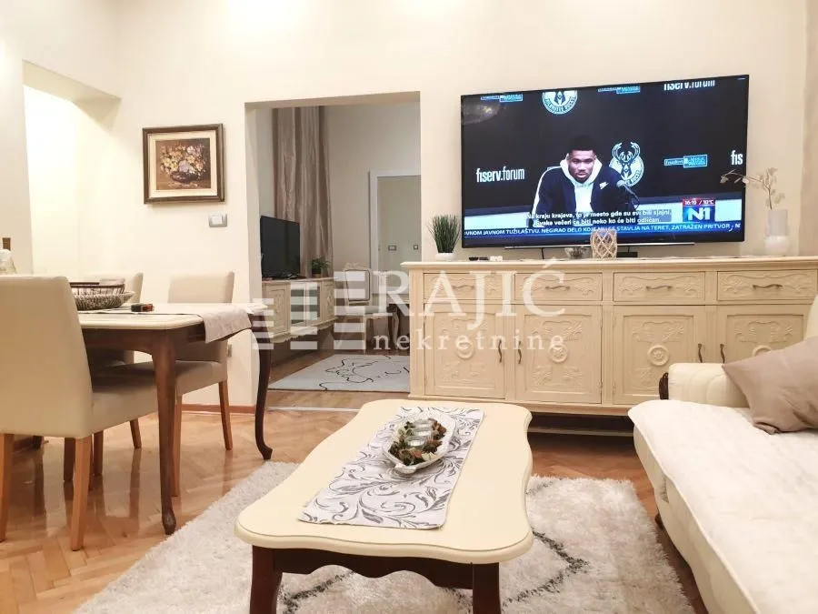 Spacious living room with a sofa set and dining table.