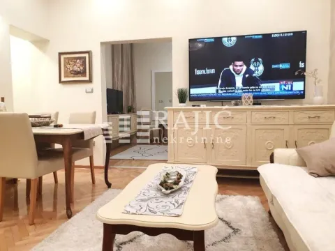 Spacious living room with a sofa set and dining table. - image 4
