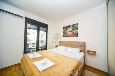Bedroom with a double bed, air conditioning, and access to the terrace. - image 7