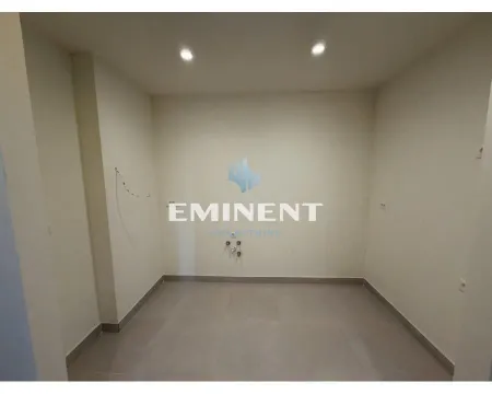 Empty room with tiled flooring and prepared utility connections. - image 14