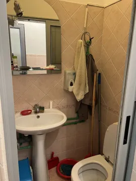 Small bathroom with a sink and toilet. - image 3