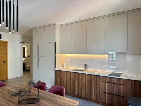 Modern kitchen with wooden elements and built-in lighting. - image 5