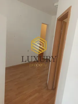 Empty room with hardwood floors and a wooden door. - image 4