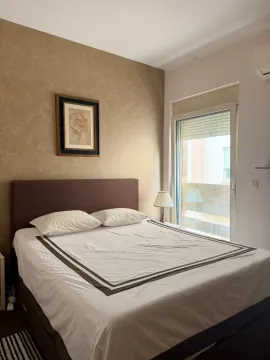 Furnished bedroom with a double bed and access to the terrace. - image 5