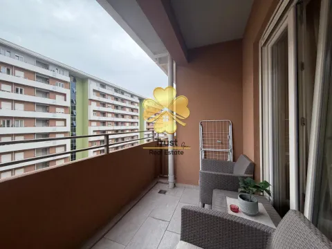 Furnished balcony with seating set and view of buildings. - image 8