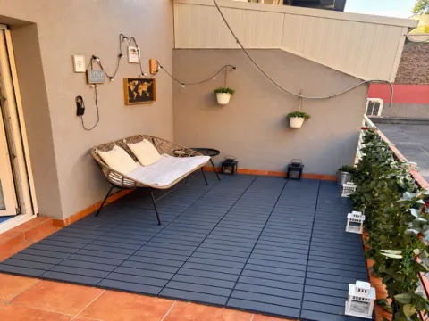 Furnished terrace with seating furniture, decorative lighting and plants. - image 3