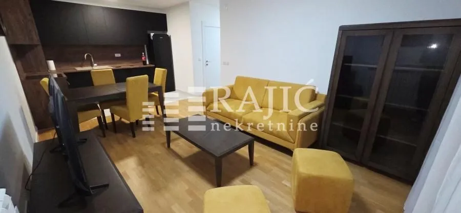 Living room connected to the dining area and kitchen.