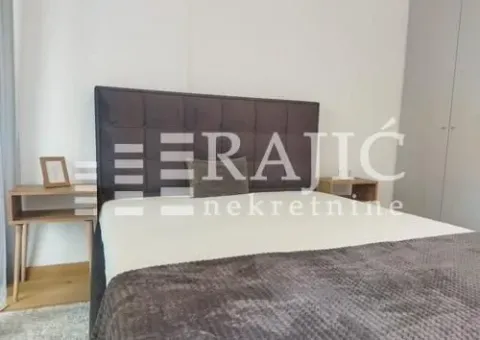 Modern bedroom with a double bed and bedside tables. - image 9